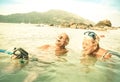 Senior couple vacationer having genuine fun on tropical beach Royalty Free Stock Photo