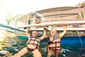 Senior couple vacationer having genuine playful fun at beach in Philippines - Snorkel boat trip in exotic scenario - Active