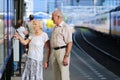 Senior couple waiting for train at railway station Royalty Free Stock Photo