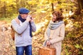 Senior couple on a walk in autumn forest. Royalty Free Stock Photo