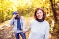 Senior couple on a walk in autumn forest. Royalty Free Stock Photo