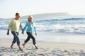 Senior Couple Walking Along Beach Royalty Free Stock Photo