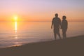 Senior couple walking along the beach Royalty Free Stock Photo