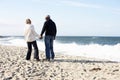 Senior Couple Walking Along Beach Together Royalty Free Stock Photo