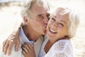 Senior Couple Walking Along Beach Together Royalty Free Stock Photo