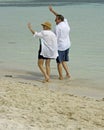 Senior couple walking beach Royalty Free Stock Photo