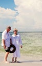 Senior couple walking beach Royalty Free Stock Photo