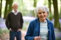 Senior Couple Walking Through Bluebell Woods Royalty Free Stock Photo