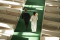 Senior Couple Walking Down Aisle in Church During Wedding Ceremony Royalty Free Stock Photo