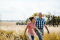 Senior couple walking down a path in nature