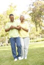 Senior Couple Walking In Park Royalty Free Stock Photo