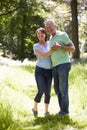 Senior Couple Walking In Summer Countryside Royalty Free Stock Photo