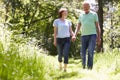 Senior Couple Walking In Summer Countryside Royalty Free Stock Photo