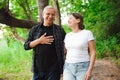 Senior couple walking together in a forest, close-up. Royalty Free Stock Photo