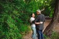 Senior couple walking together in a forest, close-up. Royalty Free Stock Photo