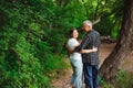 Senior couple walking together in a forest, close-up. Royalty Free Stock Photo