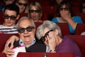 Senior Couple Watching 3D Film In Cinema Royalty Free Stock Photo