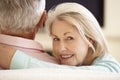 Senior Couple Watching Widescreen TV At Home Royalty Free Stock Photo