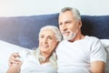 Senior couple wathcing tv at home Royalty Free Stock Photo