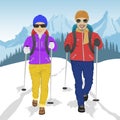 Senior couple wearing hiking gear walking in mountains in winter Royalty Free Stock Photo