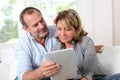 Senior couple websurfing with tablet Royalty Free Stock Photo