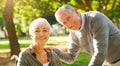 Senior couple, wheelchair and portrait outdoor at a park with love, care and support for health and wellness. Face of