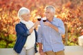 Senior couple, wine tasting and drink together for memories, relationship and retirement on vineyard. Toasting, man and Royalty Free Stock Photo