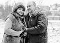 Christmas Holidays, woman and senior man walk at park Royalty Free Stock Photo