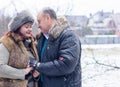 Christmas Holidays, woman and senior man walk at park Royalty Free Stock Photo