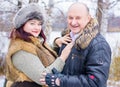 Christmas Holidays, woman and senior man walk at park Royalty Free Stock Photo