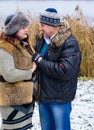 Christmas Holidays, woman and senior man walk at park Royalty Free Stock Photo