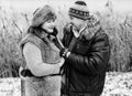 Christmas Holidays, woman and senior man walk at park Royalty Free Stock Photo