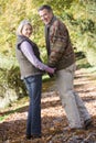 Senior couple on woodland walk
