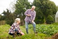 Senior couple working in garden or at summer farm Royalty Free Stock Photo