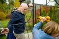 Senior couple working on a project in their garden. Man and woman constructing a greenhouse in their backyard Royalty Free Stock Photo