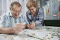 Senior couple working on a puzzle Royalty Free Stock Photo