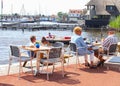 Elderly couple young people cafe terrace drinks lake, Loosdrecht, Netherlands Royalty Free Stock Photo