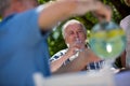 Senior couples having breakfast in garden Royalty Free Stock Photo