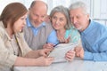 senior couples reading newspaper Royalty Free Stock Photo