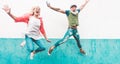 Senior crazy couple jumping outdoor - Mature trendy people having fun dancing and celebrating outside - Joyful elderly lifestyle Royalty Free Stock Photo