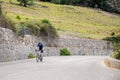 Senior cyclist climbing up a mountain pass