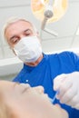 Senior dentist taking care females patients teeth Royalty Free Stock Photo