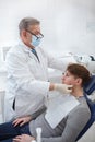 Senior dentist working at his clini Royalty Free Stock Photo