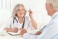 Portrait of senior doctor talk with elderly patient Royalty Free Stock Photo