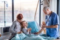 Doctor examining a small hospitalized girl with mother in hospital. Royalty Free Stock Photo