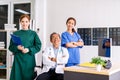 Senior Doctor sitting In Center Of Team with nurse and female doctor Surgeon portrait in office at hospital. Royalty Free Stock Photo