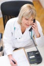 Senior doctor speaking phone Royalty Free Stock Photo