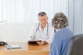 A senior doctor talking with his patient Royalty Free Stock Photo