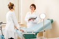 Senior doctor with young assistant in the gynecological office Royalty Free Stock Photo