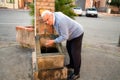 Senior drinking from fountain Royalty Free Stock Photo